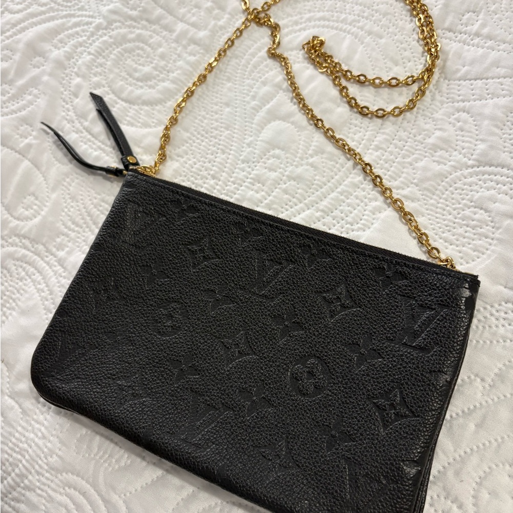 Louis Vuitton double zip pochette empreinte leather.